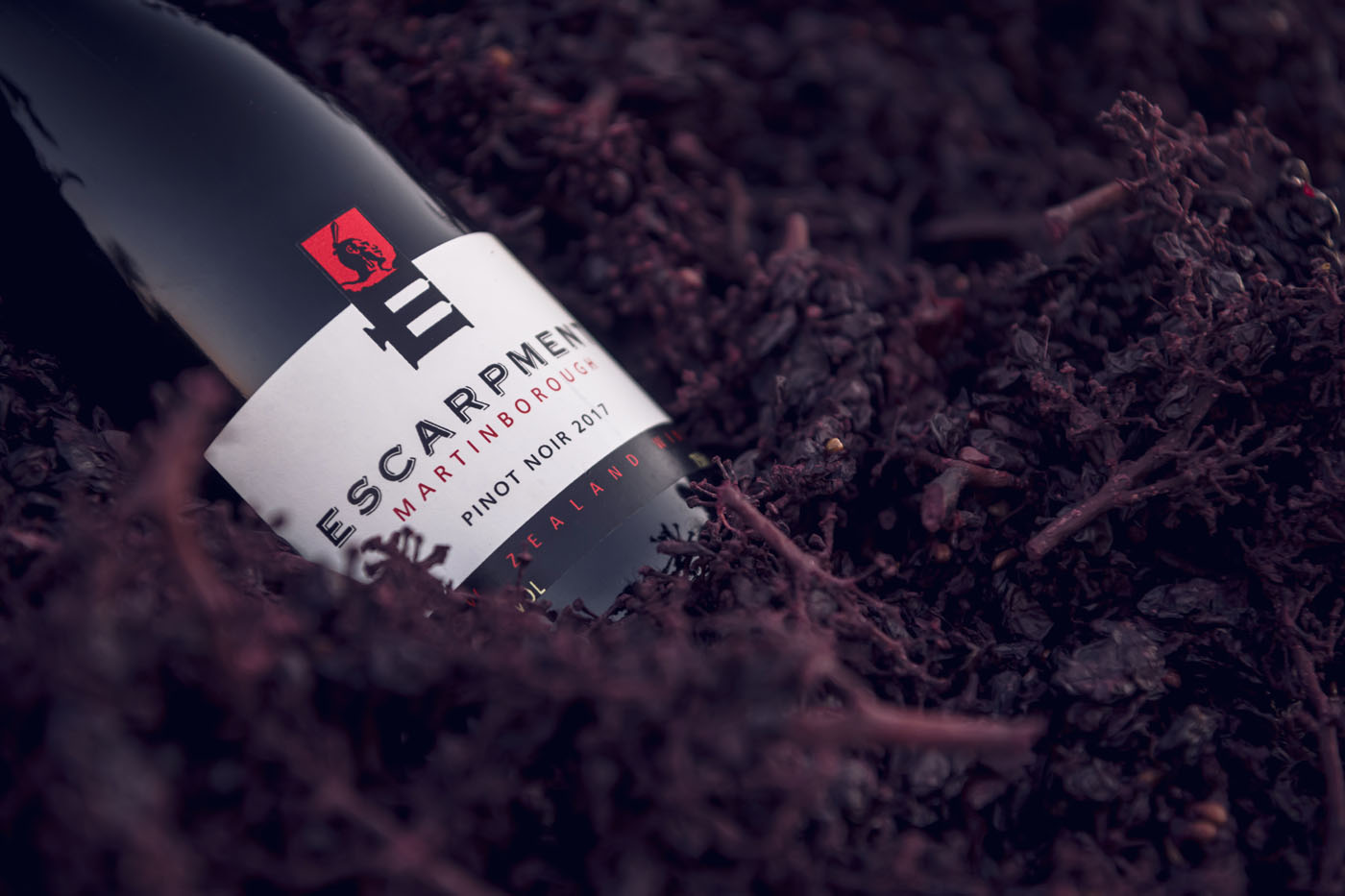 The Escarpment Pinot Noir lying in grape marc